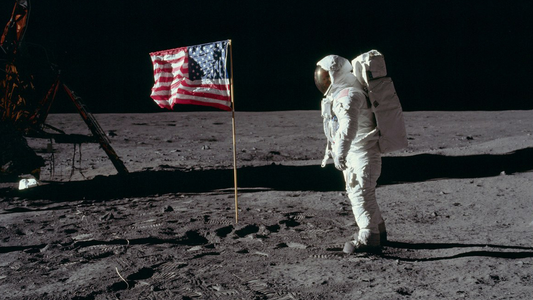 Buzz Aldrin stands beside the American flag on the Moon during the Apollo 11 mission, July 1969. Photo by Neil Armstrong / Credit: NASA